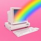 An old desktop computer with a rainbow projecting from the screen on a field of pink