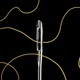 A needle with gold thread running through it