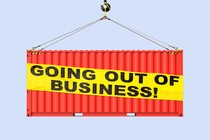 A crane lifting a billboard that reads: “Going out of business!”