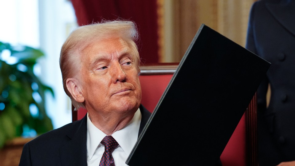 Donald Trump holds an executive order