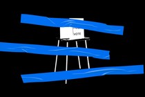 A voting booth with blue tape over it