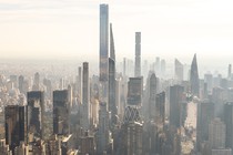 photo of Midtown Manhattan skyline with supertall buildings and shorter skyscrapers, with Central Park visible on left