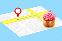 A street map with a destination pin and a cupcake overlaid
