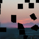 A dusky image of a Texas skyline with black cutouts over it.