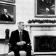 A black-and-white photo of Kevin McCarthy and Joe Biden sitting side by side