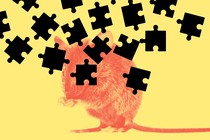 A red mouse on a yellow background with black puzzle pieces raining down