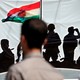 A man looks at a banner supporting the referendum for independence of Kurdistan