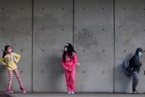 masked students standing in line