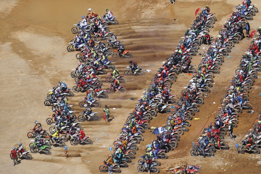 Hundreds of motorcyclists lined up at the start of a race