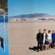 an upside-down French flag next to a photo of a French family in Algeria