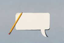 pencil over a white cutout of a blank speech bubble 