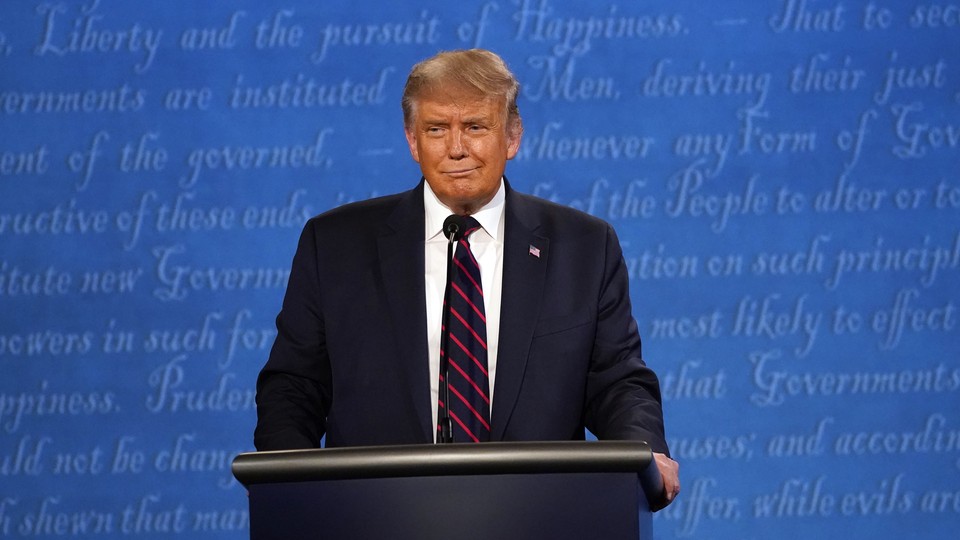 President Donald Trump stands at a podium at the first presidential debate.