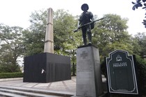 A plywood partition surrounds a Confederate monument in Birmingham, Alabama's Linn Park.