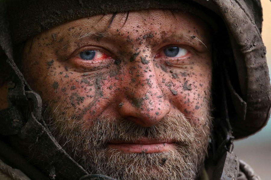 A close view of the mud-covered face of a soldier