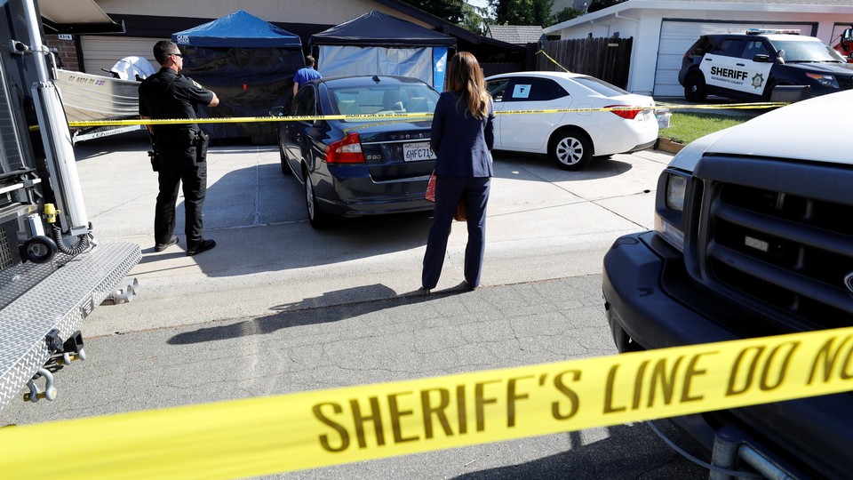 Crime scene tape in front of a house