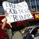 A man holds a pro-Trump sign in New York.