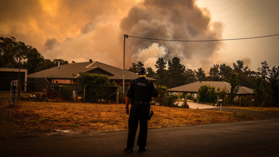 Bushfires approach homes near Sydney, Australia.