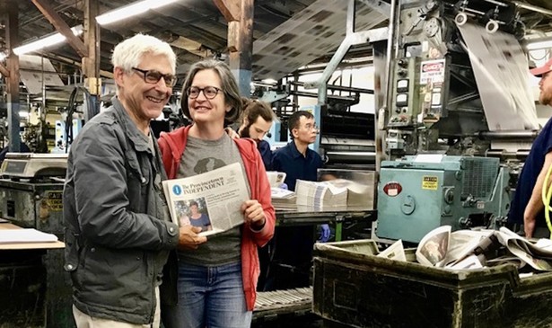 Editor Ed Miller and publisher Teresa Parker with Vol. 1 No. 1 of The Provincetown Independent as it comes off the press on Sept. 6