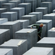 A worker at the Memorial to the Murdered Jews of Europe cleans the memorial grounds.