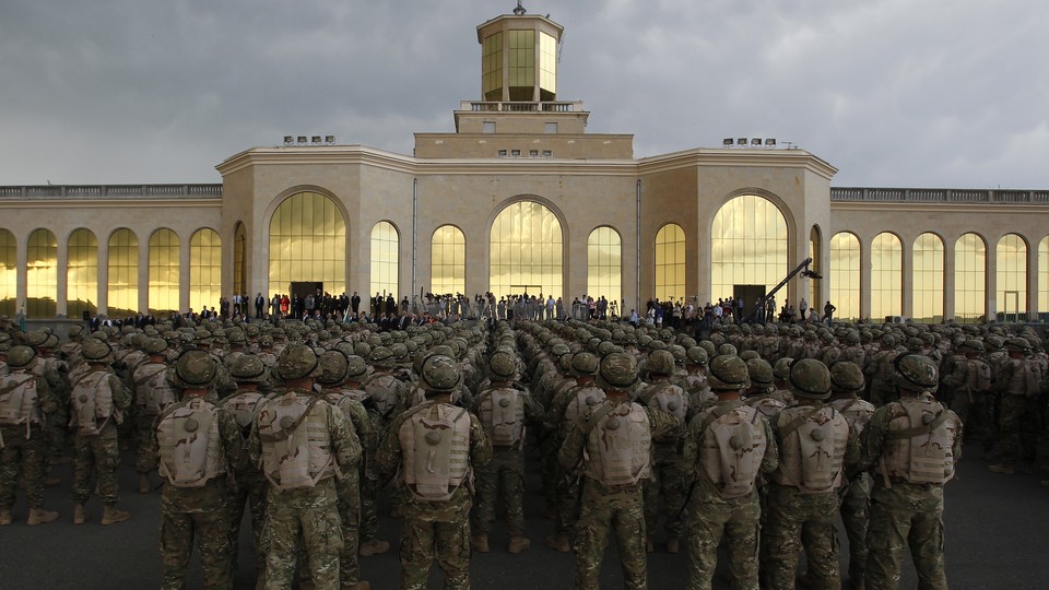 Georgian soldiers attend a farewell ceremony in Tbilisi before leaving for Afghanistan in 2013.