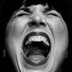 A close up of a woman screaming