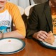 A photo of kids eating pizza