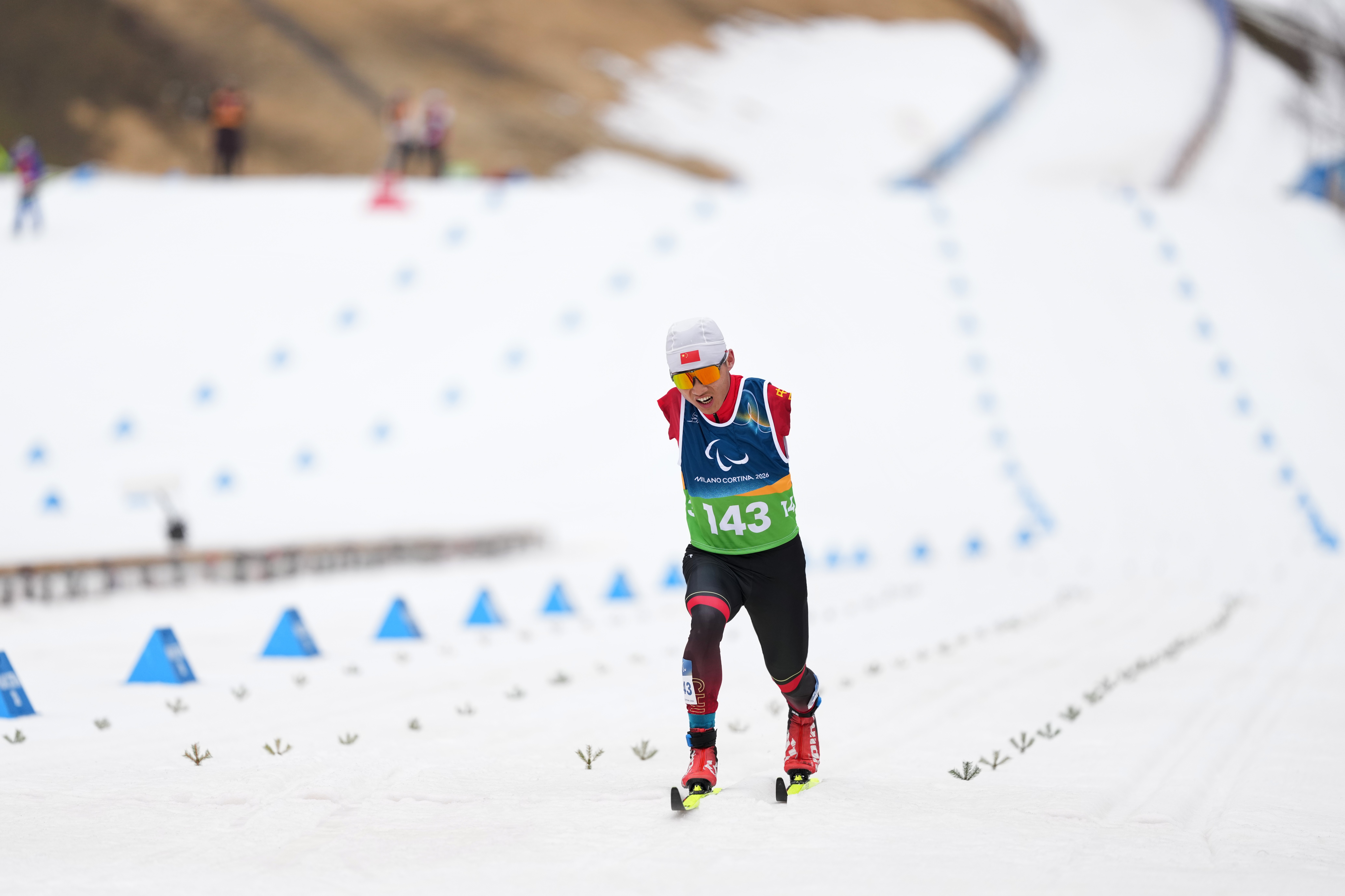 A Paralympic athlete with no arms competes in a cross-country ski race.