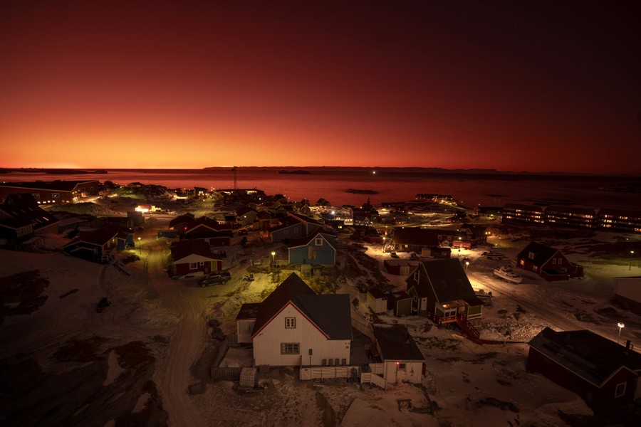 An elevated view of a residential neighborhood in Greenland at sunset