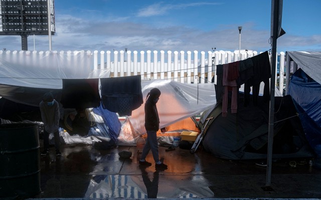 A girl walking through El Chaparral crossing port