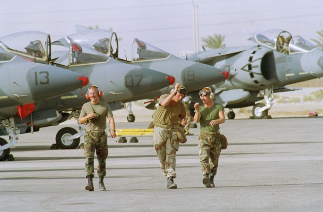 U.S. Marines walk past Marine jets at a Saudi airbase in 1990 during the Gulf War.