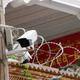 A propaganda banner and a security camera are placed on the walls of a mosque in the Old City in Kashgar, Xinjiang Uighur Autonomous Region, on September 6, 2018