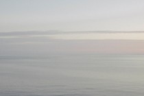 A grainy, hazy photograph of the Black Sea and Abrau Peninsula