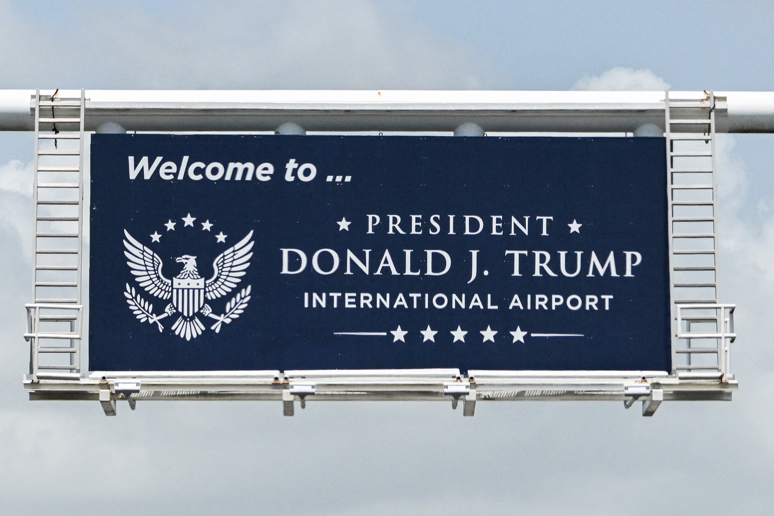 A highway sign at President Donald J Trump International Airport