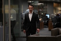 Kendall Roy of "Succession" marching through an office