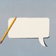 pencil over a white cutout of a blank speech bubble 