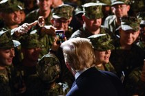 Donald Trump greets a group of marines.