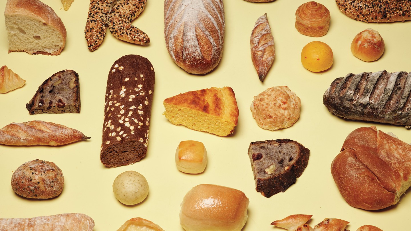 photo of many different types of breads on yellow background