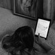 A woman scrolling through her iPad.