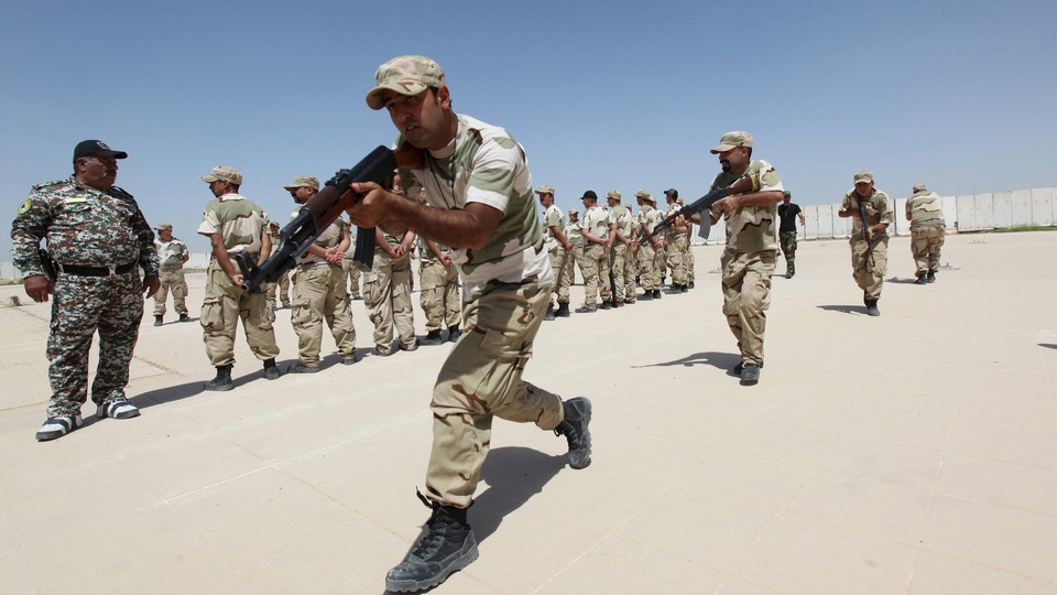 Iraqi Christians volunteers, who have joined Hash’d al Shaabi (Popular Mobilization), allied with Iraqi forces against the ISIS, take part in a training at a military camp in Baghdad in 2015.