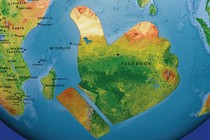 A map of a globe with a large landmass shaped like Facebook's "Like" thumbs-up sign off the coast of Africa