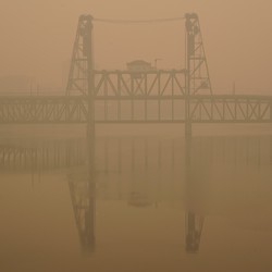 The Portland Steel Bridge covered in smoke from wildfires.