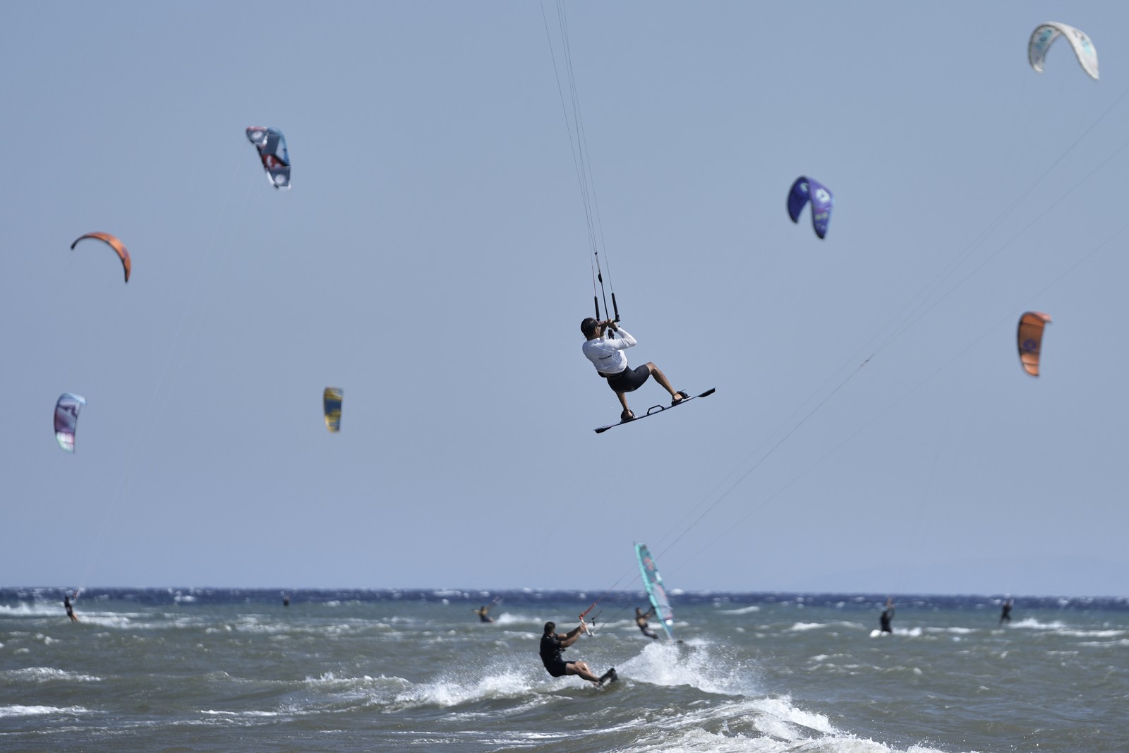 Many kiteboarders sail together.