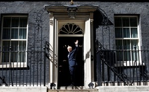 Boris Johnson walks through the door at Number 10 Downing Street.