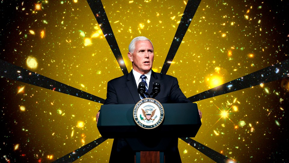 Mike Pence stands at a podium
