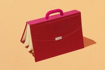 a pink briefcase made out of a book