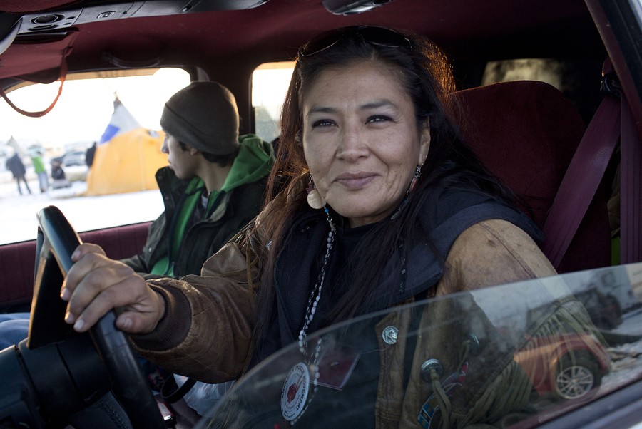 An American Indian Movement supporter drives through the Oceti Sakowin camp just outside of the Lakota Sioux reservation of Standing Rock, North Dakota, on December 3, 2016.