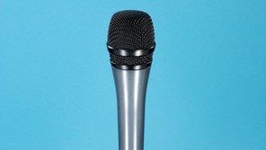Microphone against a blue background