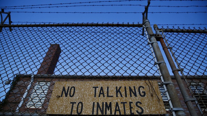 A jail with the sign "No Talking to Inmates"
