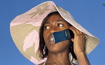 Photograph of a woman on a flip phone