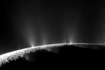 A spacecraft image of the south pole of Enceladus, Saturn's icy moon, spewing water vapor into space through cracks in its frigid surface